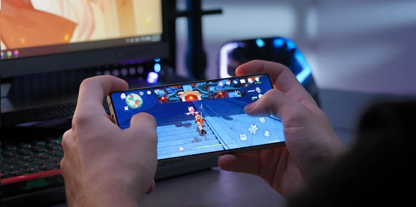 Smartphone displaying a fictional mobile game interface at an Australian gaming technology exhibition